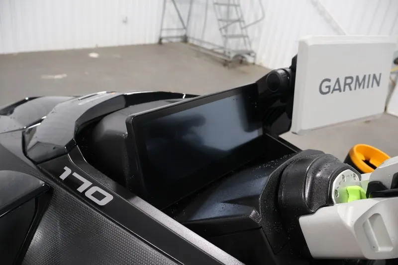 Slide: The Image of 2026 Sea-Doo FishPro Trophy 170 with Garmin display in a garage setting. - 10