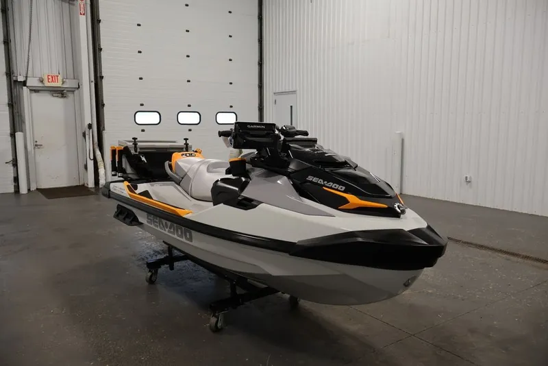 Slide: The Image of 2026 Sea-Doo FishPro Trophy 170 jet ski in a garage setting. - 5