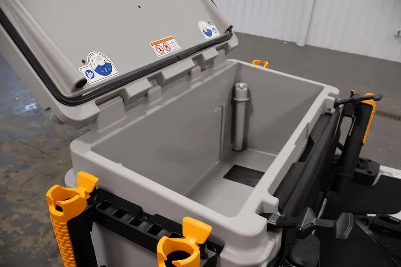 Slide: The Image of Open storage compartment of 2026 Sea-Doo FishPro Trophy 170, featuring rod holders and utility space. - 22