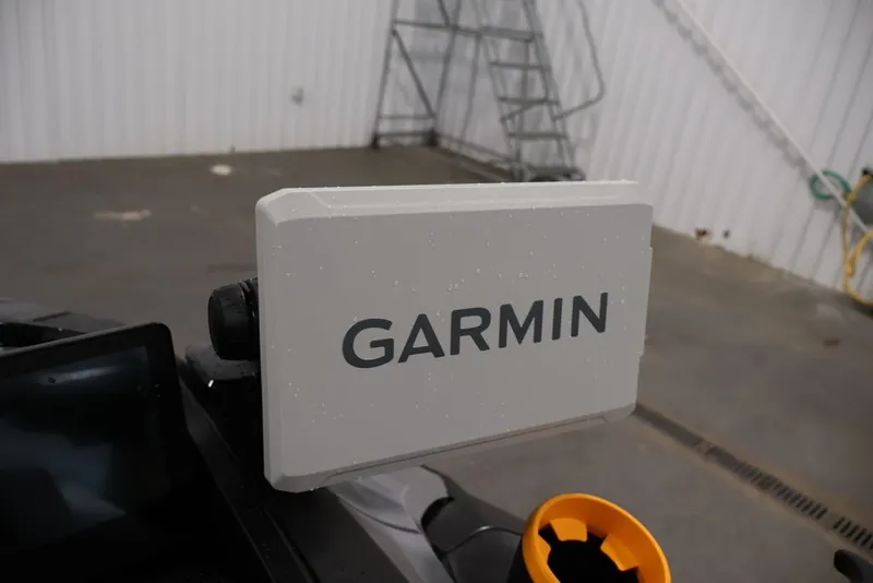 Slide: The Image of Garmin device on 2026 Sea-Doo FishPro Trophy 170 in a garage setting. - 11
