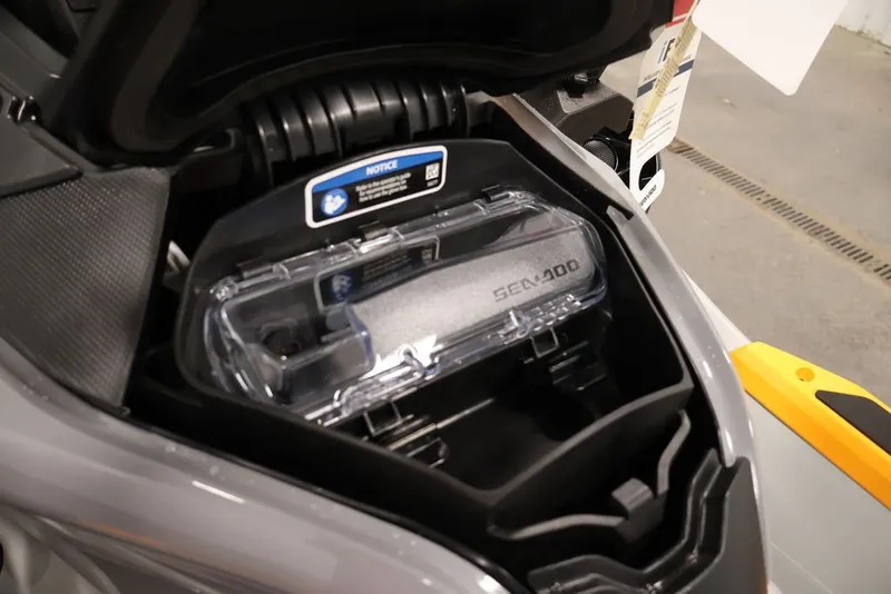 Slide: The Image of 2026 Sea-Doo FishPro Trophy 170 storage compartment with clear cover and branding. - 15