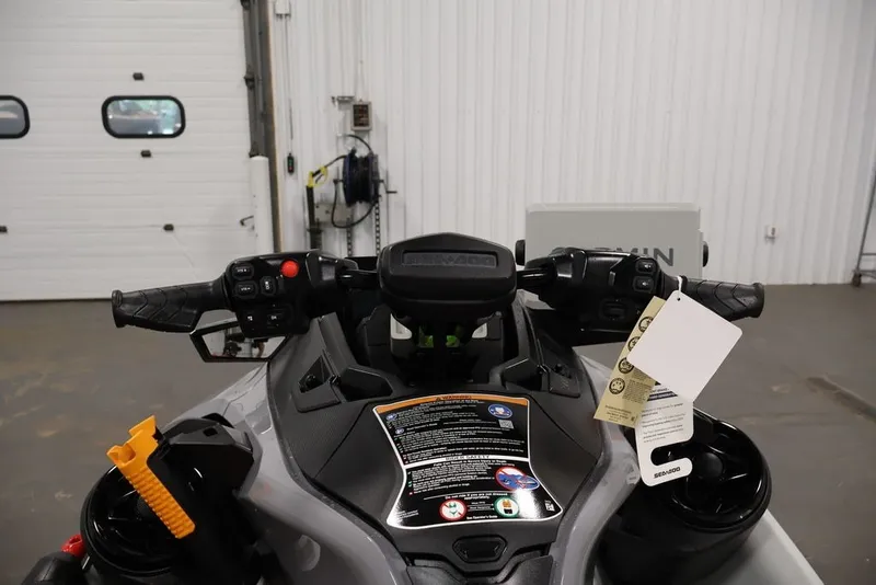 Slide: The Image of 2026 Sea-Doo FishPro Trophy 170 dashboard and controls in a garage setting. - 13