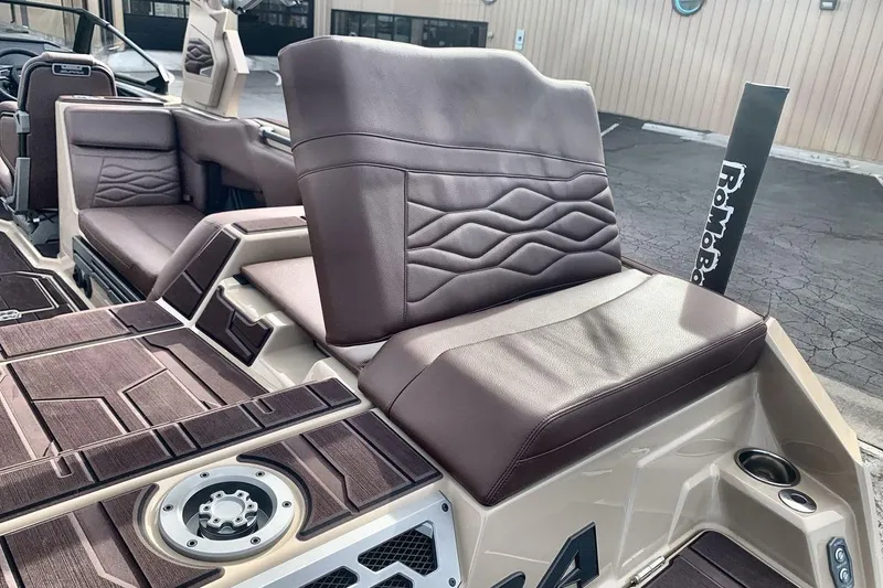 Slide: The Image of Luxurious seating on 2026 Supra SE 550 boat with brown leather upholstery. - 19