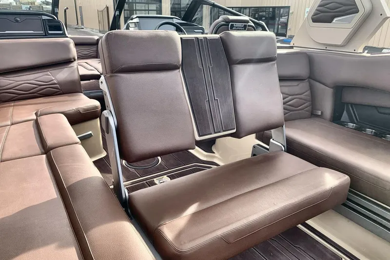 Slide: The Image of 2026 Supra SE 550 boat interior with luxurious brown leather seating. - 20