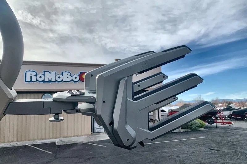 Slide: The Image of Rugged Supra SE 550 boat accessory against a cloudy sky, 2026 model. - 22