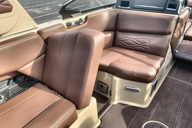 Slide: The Image of Luxurious brown leather seating in 2026 Supra SE 550 boat interior. - 26