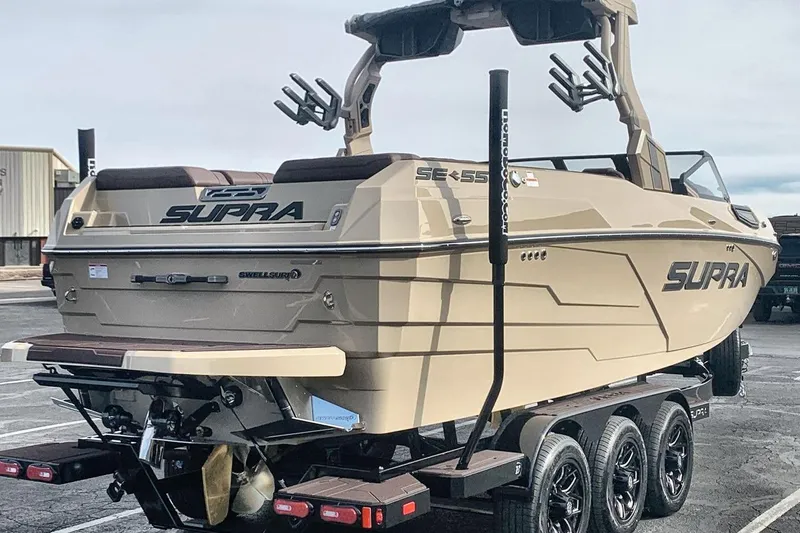Slide: The Image of 2026 Supra SE 550 boat on trailer, showcasing sleek design and advanced features. - 7