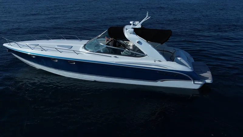 Slide: The Image of 2006 Formula 400 Super Sport boat cruising on calm blue water. - 10