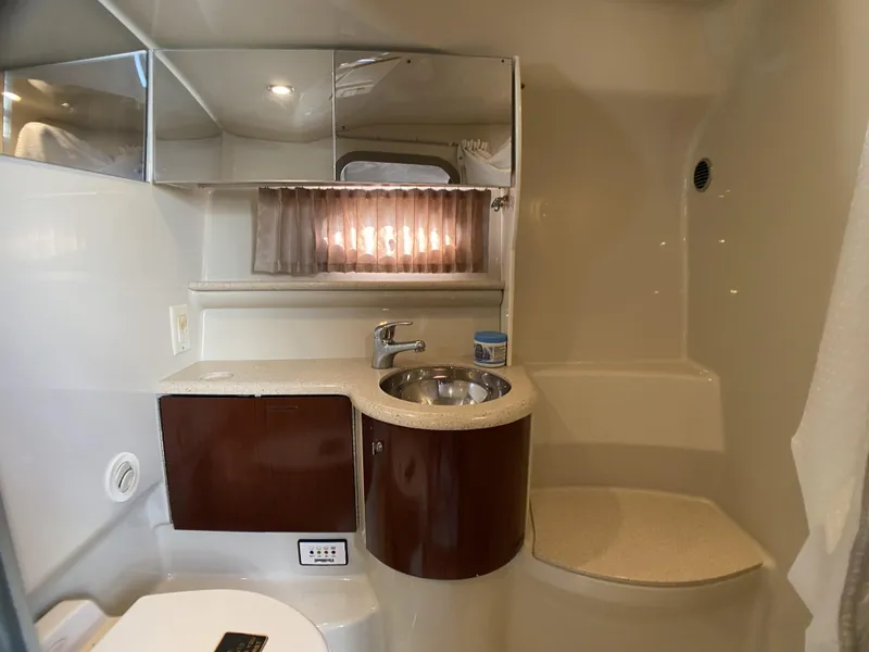 Slide: The Image of 2006 Formula 400 Super Sport bathroom with sink, mirror, and storage cabinets. - 18