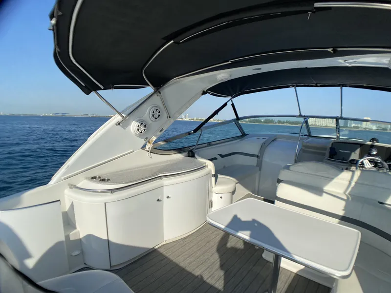 Slide: The Image of 2006 Formula 400 Super Sport yacht interior with seating and table on open water. - 37