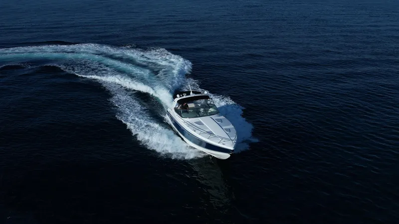Slide: The Image of 2006 Formula 400 Super Sport yacht cruising on open water, creating a dynamic wake. - 5