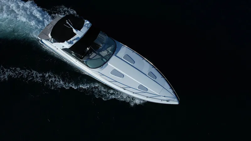 Slide: The Image of Aerial view of a 2006 Formula 400 Super Sport boat cruising on dark water. - 9