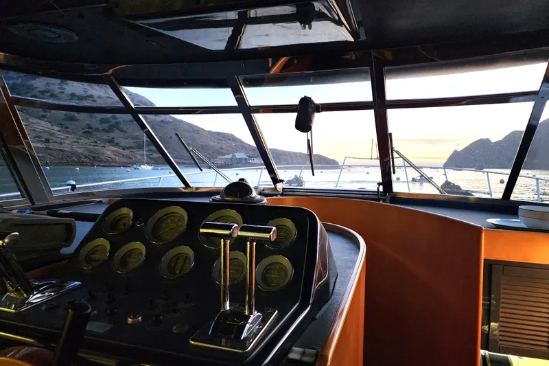 Slide: The Image of 1987 Riva SuperAmerica yacht cockpit with scenic ocean view at sunset. - 11