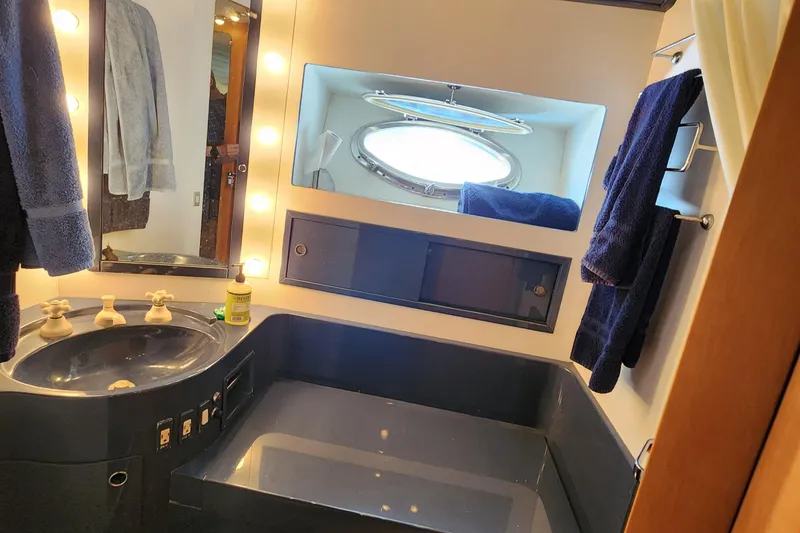 Slide: The Image of Luxurious 1987 Riva SuperAmerica yacht bathroom with modern fixtures and elegant lighting. - 20