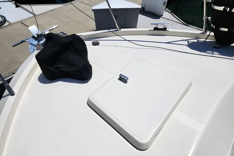 Slide: The Image of 1987 Riva SuperAmerica yacht deck with hatch and black cover. - 26