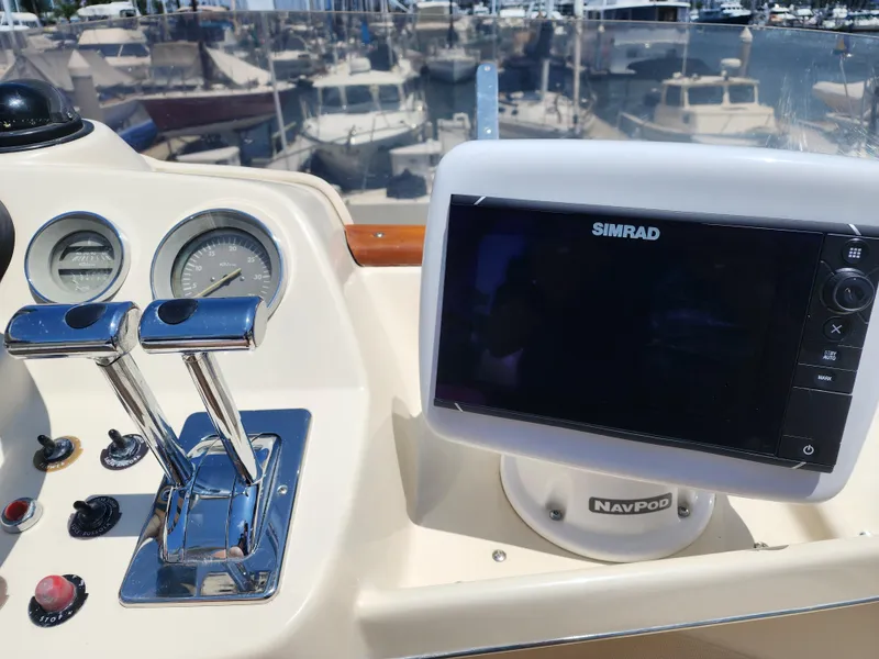 Slide: The Image of Control panel of a 1987 Riva SuperAmerica yacht with Simrad navigation system. - 33