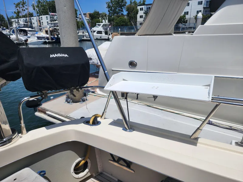 Slide: The Image of 1987 Riva SuperAmerica yacht docked at marina with Magma grill. - 40