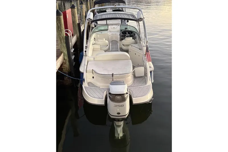 Slide: The Image of 2009 Monterrey 278s boat docked, featuring a Suzuki 350 outboard motor. - 17