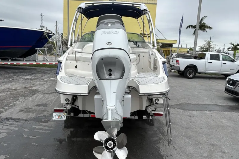 Slide: The Image of Rear view of a 2009 Monterey 278 SSC boat with outboard motor in a marina. - 18