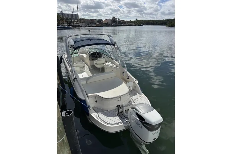 Slide: The Image of 2009 Monterey 278 SSC boat on trailer in marina, overcast sky. - 2