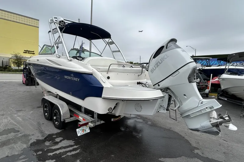 Slide: The Image of 2009 Monterey 278 SSC boat with Suzuki outboard motor on a trailer. - 29