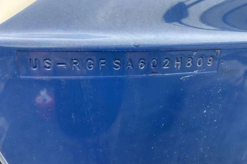 Slide: The Image of Hull identification number on a blue 2009 Monterey 278 SSC boat. - 31