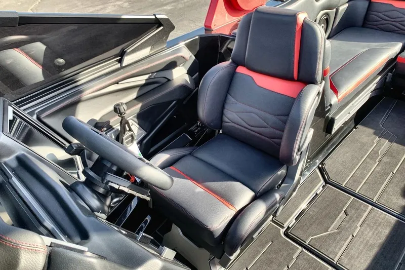 Slide: The Image of 2026 Supra SL 550 interior with sleek black and red seating and modern steering controls. - 13