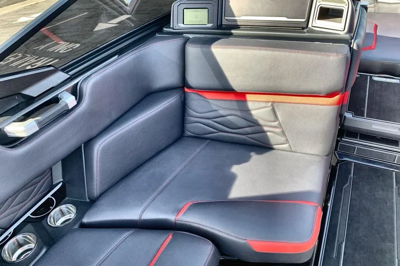 Slide: The Image of Luxurious interior of 2026 Supra SL 550 with sleek black and red leather seating. - 17