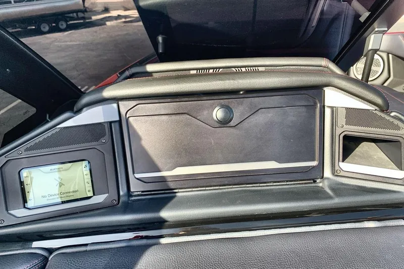 Slide: The Image of 2026 Supra SL 550 dashboard with Bluetooth display and storage compartment. - 18