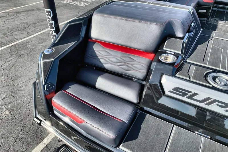 Slide: The Image of 2026 Supra SL 550 boat interior with sleek black and red seating design. - 19