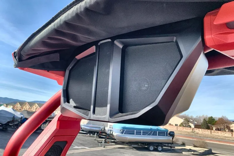 Slide: The Image of 2026 Supra SL 550 boat speaker system with red frame and outdoor setting. - 21