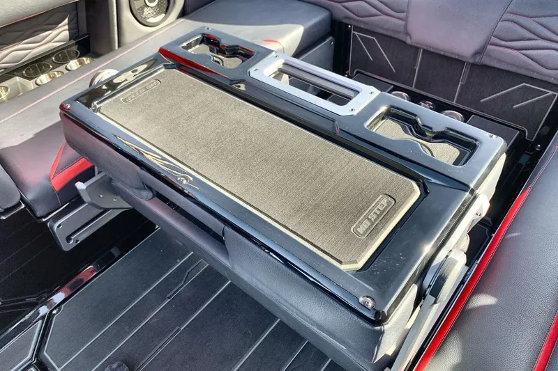 Slide: The Image of 2026 Supra SL 550 interior with foldable center console and cup holders. - 23