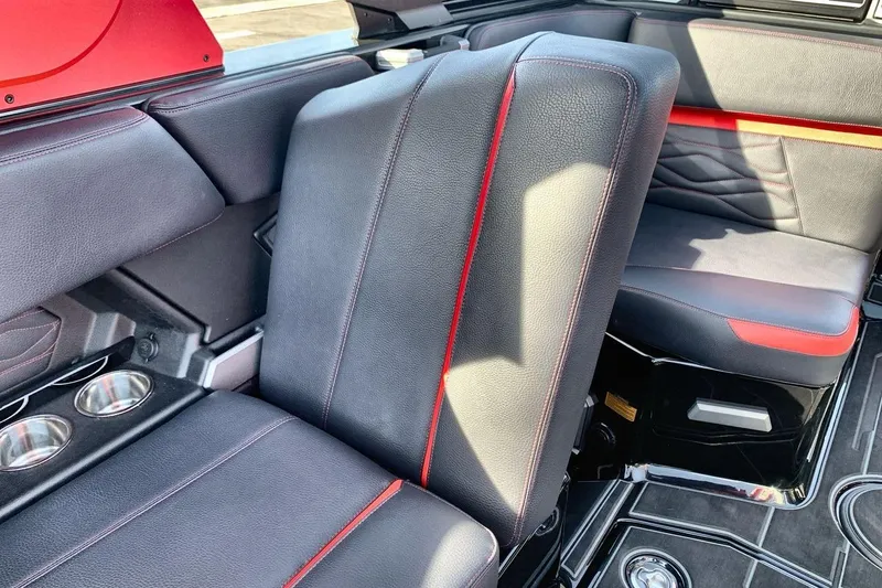 Slide: The Image of 2026 Supra SL 550 interior with black and red leather seats, cup holders, and modern design. - 25