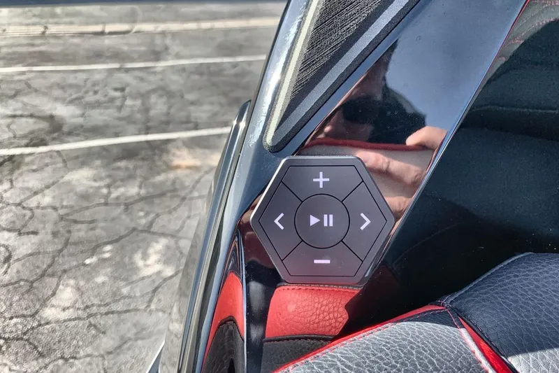 Slide: The Image of Hexagonal control panel in 2026 Supra SL 550 car interior, featuring media buttons. - 27