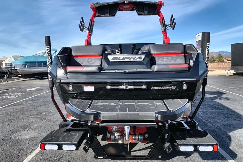 Slide: The Image of 2026 Supra SL 550 boat rear view with sleek design and advanced features. - 4
