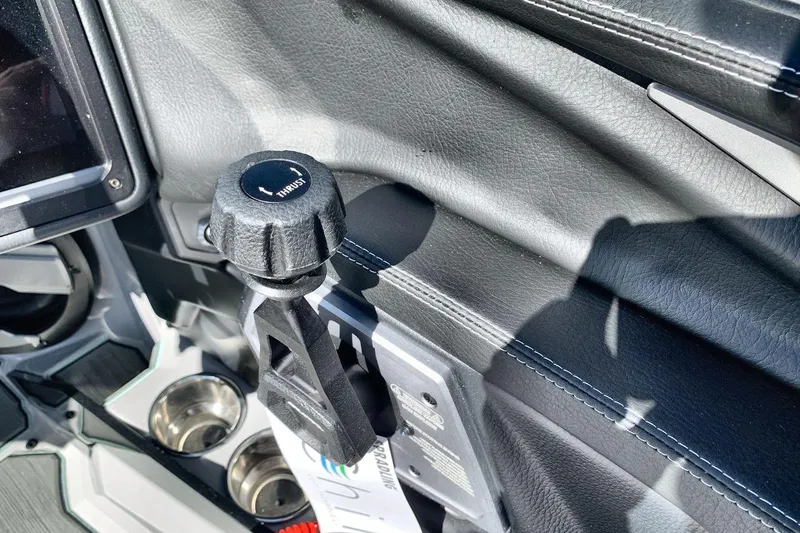 Slide: The Image of 2026 Supra SL 550 interior with thrust control knob and cup holders. - 16