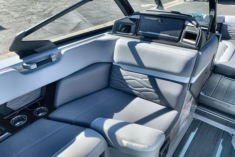 Slide: The Image of 2026 Supra SL 550 boat interior with sleek gray seating and modern design. - 17