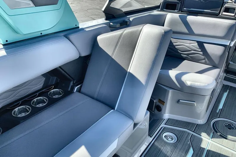 Slide: The Image of 2026 Supra SL 550 interior with gray seating and cup holders, showcasing modern design. - 24