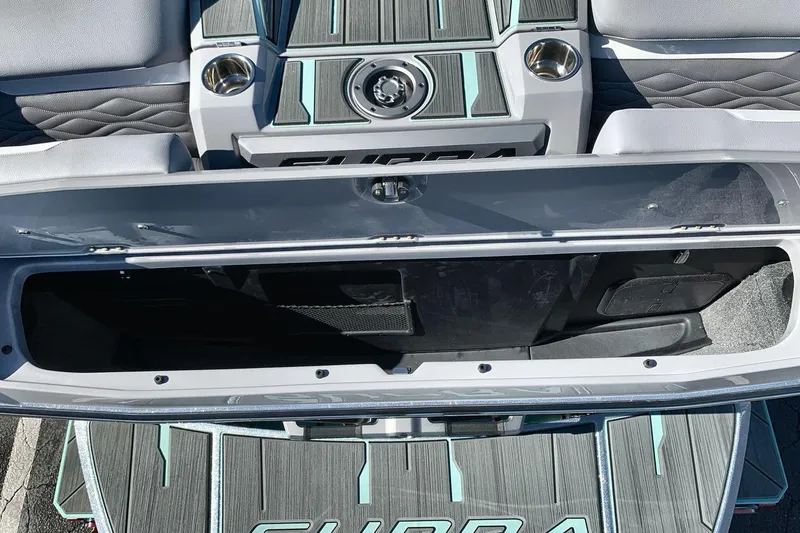 Slide: The Image of 2026 Supra SL 550 boat interior with open storage compartment and stylish seating. - 27