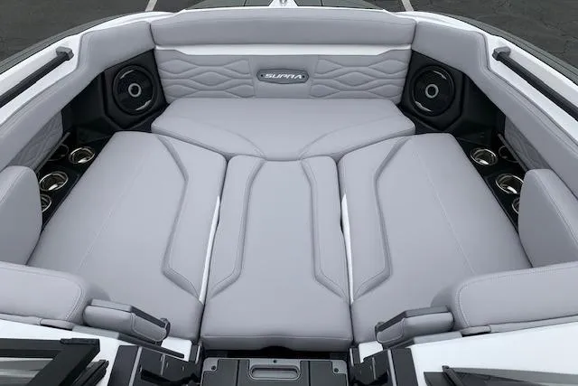 Slide: The Image of Luxurious interior of 2026 Supra SA 450 boat with plush seating and speakers. - 11