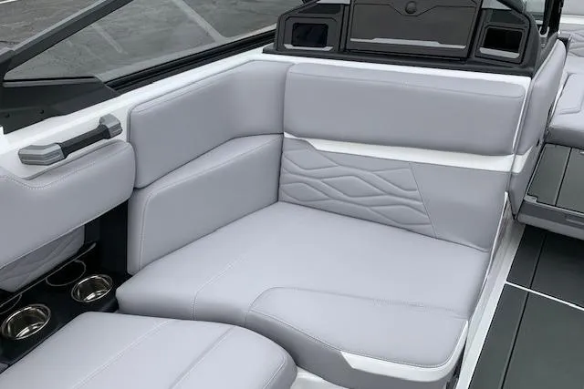 Slide: The Image of 2026 Supra SA 450 boat interior with luxurious gray seating and cup holders. - 16