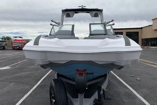Slide: The Image of 2026 Supra SA 450 boat on trailer in parking lot, front view. - 8