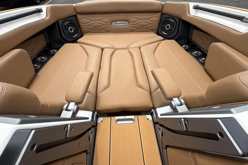 Slide: The Image of Luxurious tan interior of 2025 Supra SA 550 boat with premium seating and speakers. - 11
