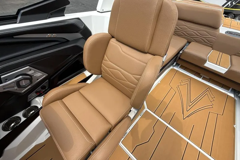 Slide: The Image of Luxurious tan seating in 2025 Supra SA 550 boat interior, featuring sleek design and premium materials. - 13