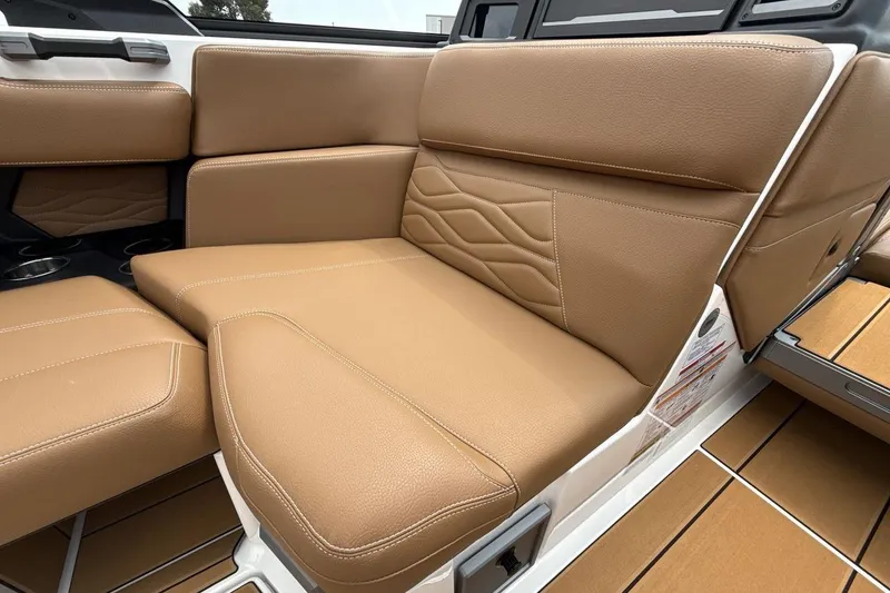 Slide: The Image of 2025 Supra SA 550 boat interior with tan leather seating and modern design. - 17