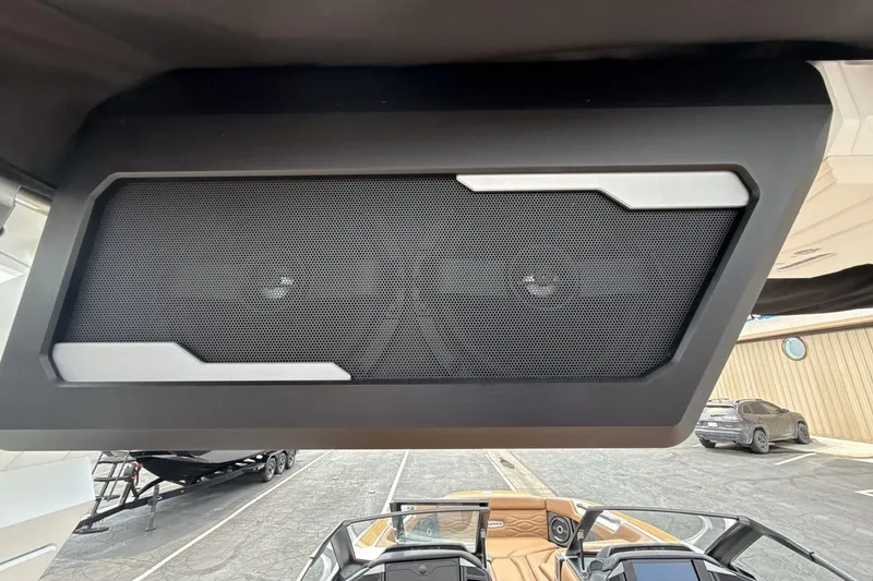 Slide: The Image of 2025 Supra SA 550 boat speaker system, sleek design, outdoor setting. - 21