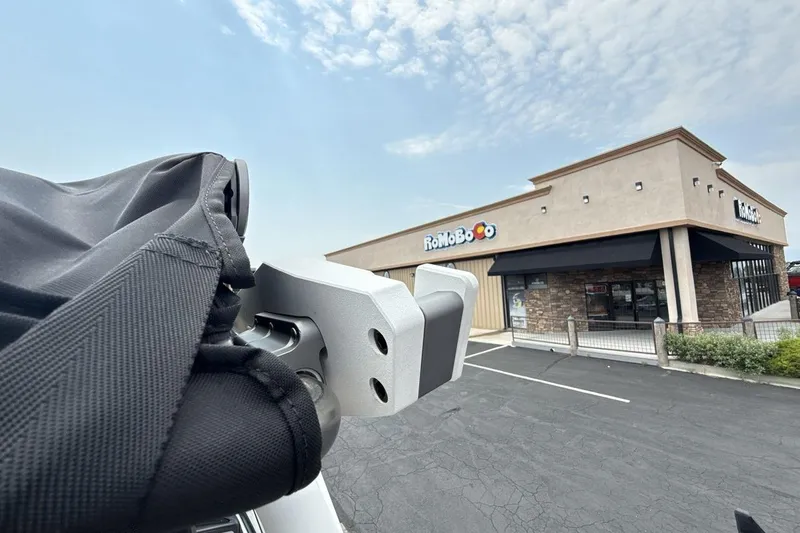 Slide: The Image of 2025 Supra SA 550 detail near RoMoBo store, clear sky background. - 26