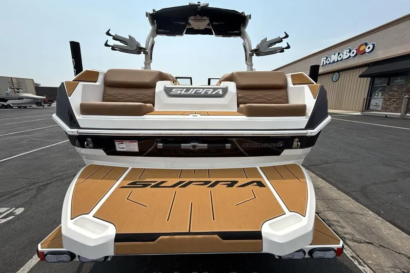 Slide: The Image of 2025 Supra SA 550 boat rear view, featuring sleek design and comfortable seating. - 4