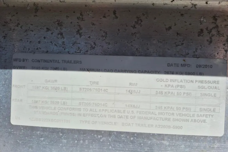 Slide: The Image of Label on Continental Trailers boat trailer, detailing weight and tire specifications, manufactured 09/2010. - 18