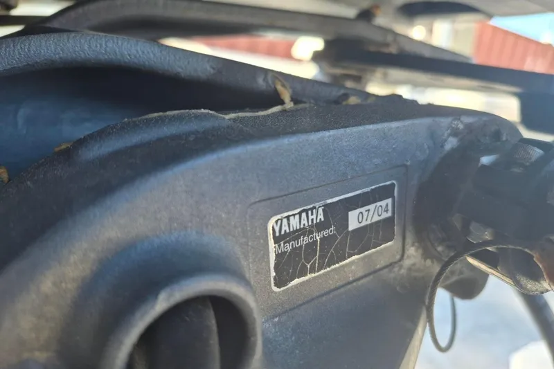 Slide: The Image of Close-up of a Yamaha manufactured part on a 1993 Dusky 227 Open Fisherman boat. - 3